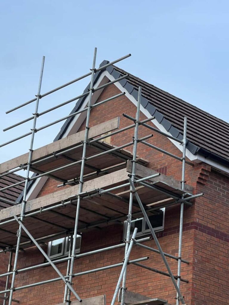 This is a photo of a roof which has just been repaired. There is a scaffold located at the gable end for access onto the roof. Works carried out by MCM Roofing Repairs Yeovil